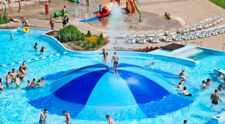 Families enjoying the outdoor pool area at Livu Akvaparks, Jurmala